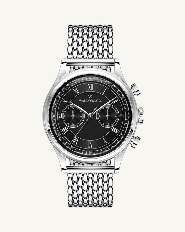 A round mens watch in rhodium-plated silver from Waldor & Co. with black sunray dial and a second hand. Seiko movement. The model is Avant 42 Sardinia 42mm.