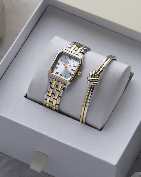 lifestyle_image, A square women’s watch and double knot bracelet in gold and silver from Waldor & co. The model is Eternal 22 Bellagio & Dual Knot Bangle.