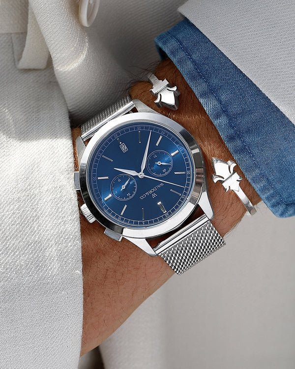  A round mens watch in rhodium-plated silver from Waldor & Co. with turquoise sunray dial and a second hand. Seiko movement. The model is Chrono 44 Sardinia 44mm.