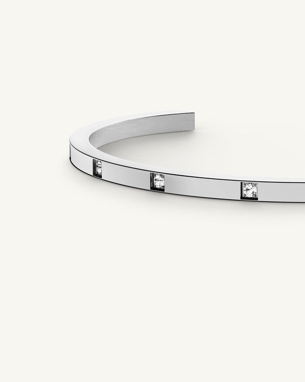 A Bangle Bracelet in rodium-plated stainless steel from Waldor & Co. The model is Brilliant Bangle Polished.