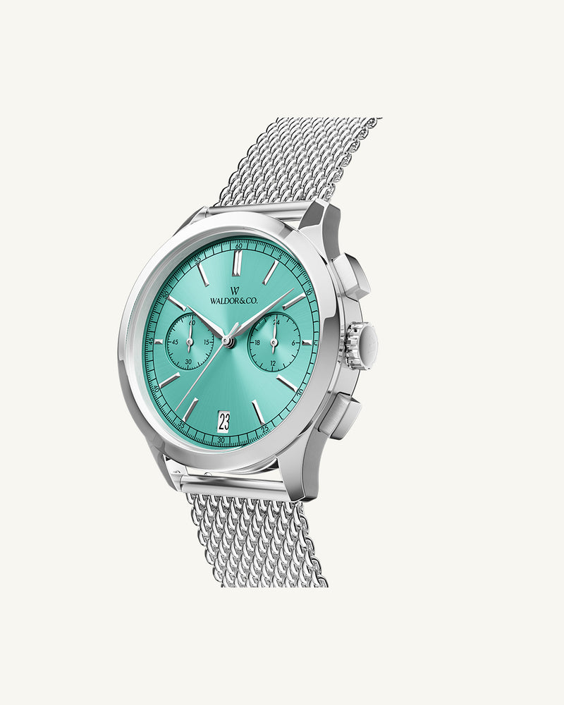 A round mens watch in rhodium-plated silver from Waldor & Co. with turquoise sunray dial and a second hand. Seiko movement. The model is Chrono 39 Sardinia 39mm.