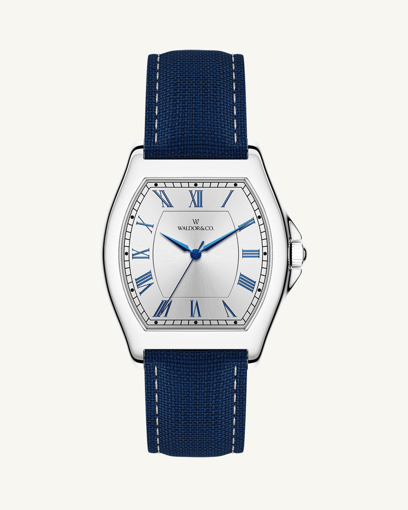 A square mens watch in Rhodium-plated 316L stainless steel from Waldor & Co. with white dial. Blue sailcloth strap. Ronda movement. The model is Constant 40 Tremezzo 37x45mm.