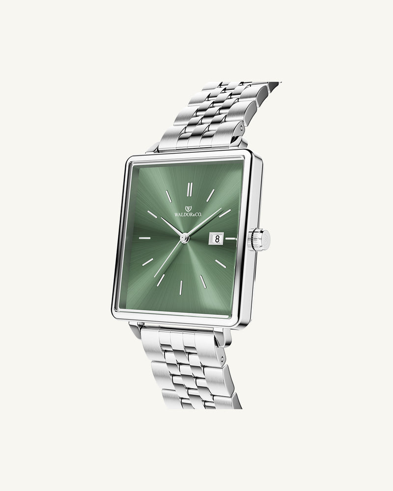 A square womens watch in silver from WALDOR & CO. with green sunray dial and a second hand. The model is Delight 32 Chelsea 28x32mm