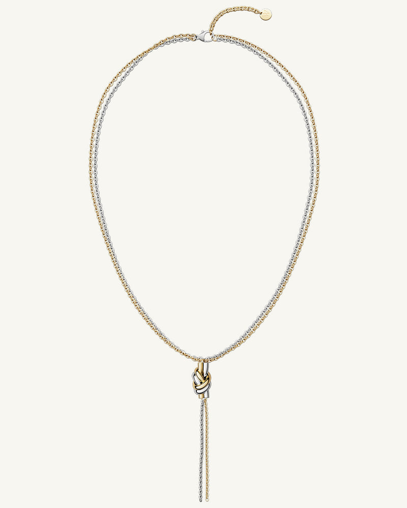 A polished stainless steel necklace in 14k gold from Waldor & Co. One size. The model is Dual Knot Ring.