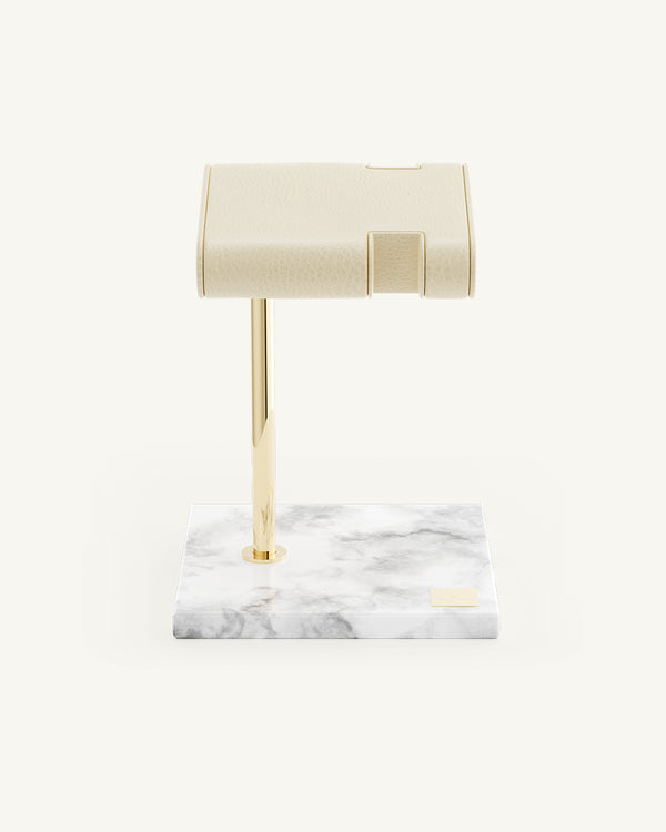 A Watch Stand in 14k gold-plated stainless steel and marble from Waldor & Co. The model is Watch Stand.'