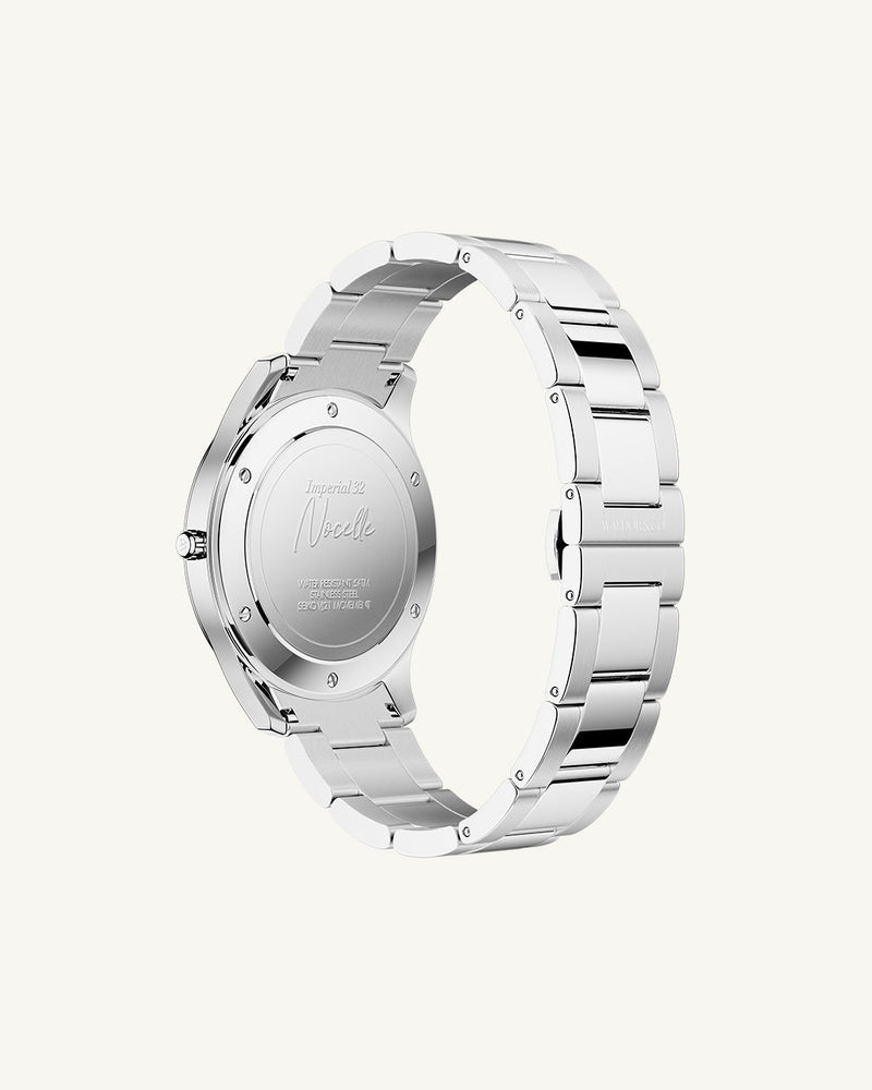 A round womens watch in silver from Waldor & Co. with black sunray dial and a second hand. Seiko movement. The model is Imperial 32 Nocelle 32mm.