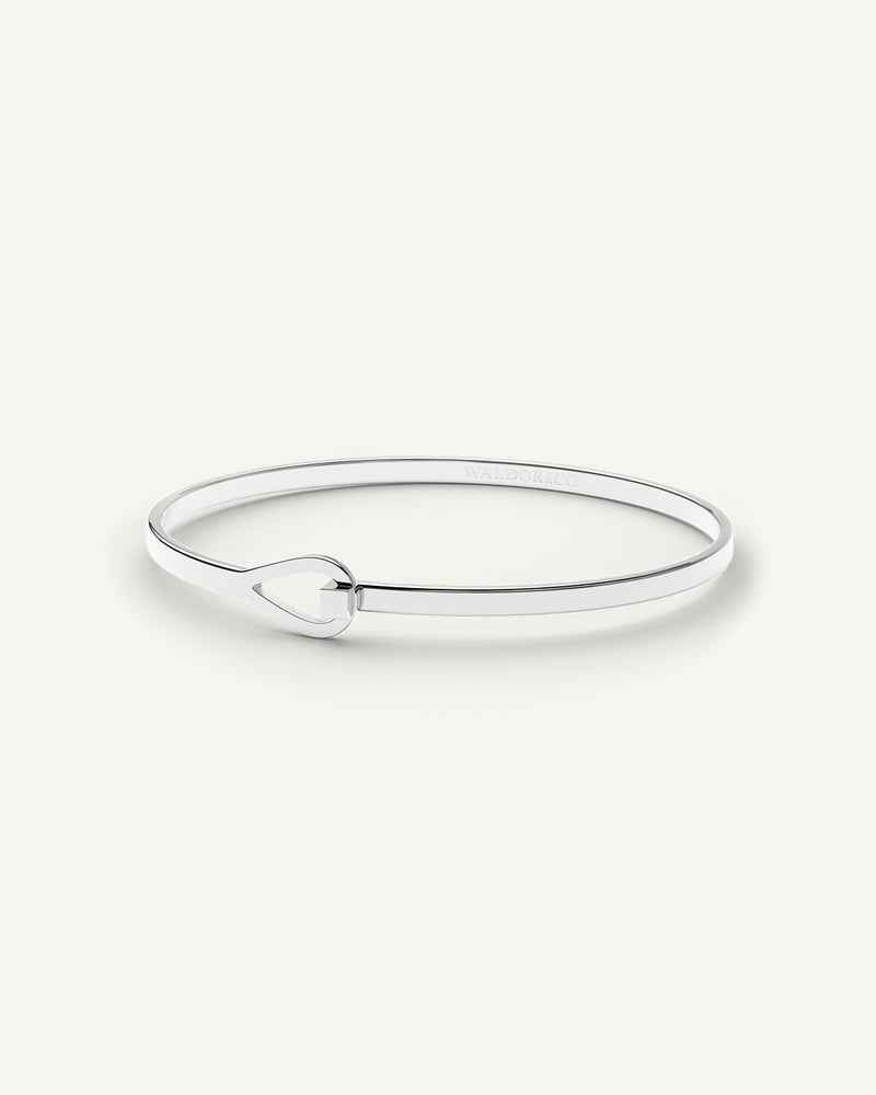 A Bracelet in polished Silver plated-316L stainless steel from Waldor & Co. The model is Signature Bracelet Polished.