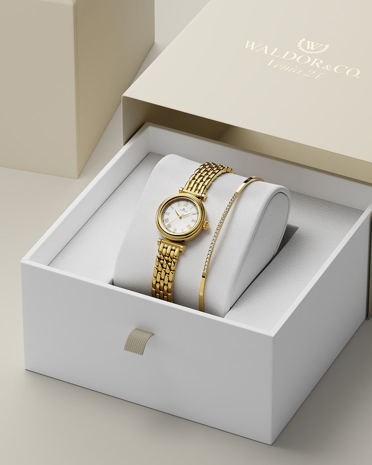  A round womens watch in 22k gold plated 316L stainless steel from Waldor & Co. with white Sapphire Crystal glass dial. Seiko movement. The model is Venia 24 Villefranche.
