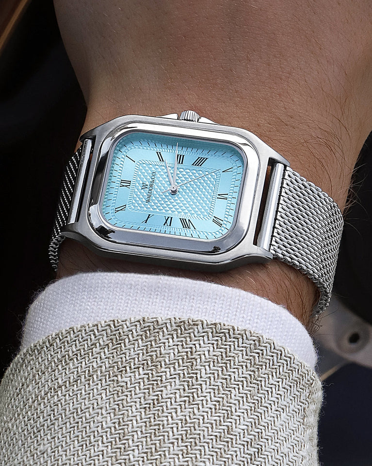  A square mens watch in silver from Waldor & Co. with light blue dial. Seiko movement. The model is Montel 40 Camogli.