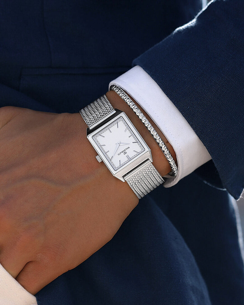A square mens watch in rhodium-plated silver from Waldor & Co. with white sunray dial. Seiko movement. The model is Conceptual 37 Antibes.