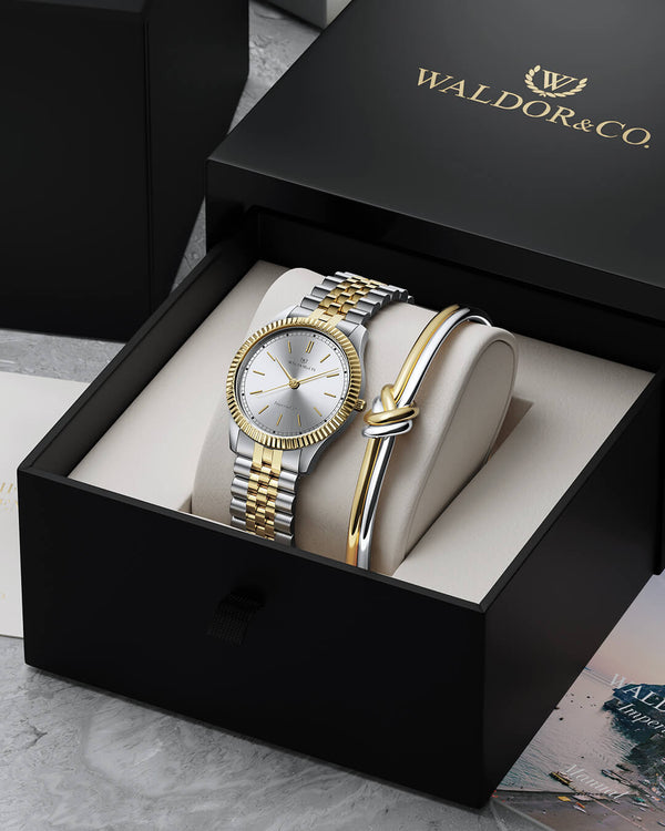 lifestyle_image,A round womens watch in silver and 22k gold from Waldor & Co. with silver sunray dial and a second hand. Seiko movement. The model is Imperial 32 Positano 32mm.